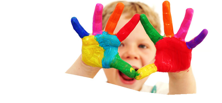 Boy with brightly painted hands